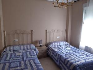 Postel nebo postele na pokoji v ubytování Calle Quevedo, 27 Apartamento. Feria