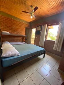 Tempat tidur dalam kamar di Residencial Varandas de Setiba