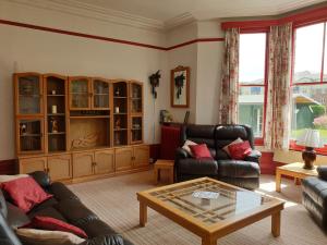 a living room with a couch and a coffee table at The Wycliffe in Folkestone