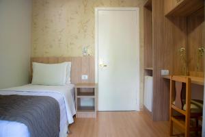 Postel nebo postele na pokoji v ubytování Hotel Rafain Centro