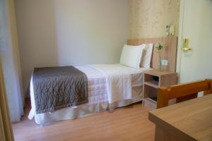 Postel nebo postele na pokoji v ubytování Hotel Rafain Centro