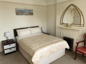 
A bed or beds in a room at The Wycliffe
