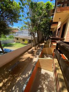 a building with stairs leading up to a building at Residencial Varandas de Setiba in Una