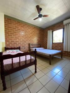 Tempat tidur dalam kamar di Residencial Varandas de Setiba