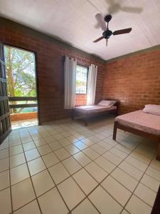 Tempat tidur dalam kamar di Residencial Varandas de Setiba