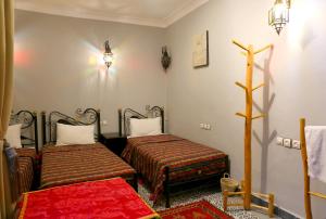 Postelja oz. postelje v sobi nastanitve Riad Bobby Marrakech