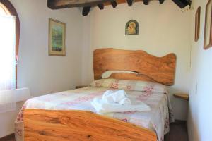 Postel nebo postele na pokoji v ubytování Agriturismo Arundineto Valle - by Bolgheri Holiday