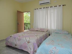 A bed or beds in a room at Hostel Park Iguazu