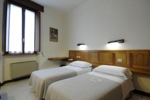 Voodi või voodid majutusasutuse Albergo Bianchi Stazione toas