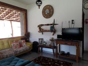 TV a/nebo společenská místnost v ubytování Casa dos Sonhos Hospedaria