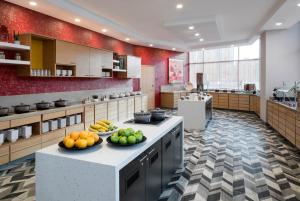 a large kitchen with fruit on a counter in it at Hyatt Place Tempe Phoenix University in Tempe