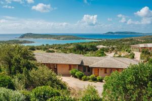 an image of a house with a view of the ocean at Résidence Les Terrasses de Rondinara in Bonifacio