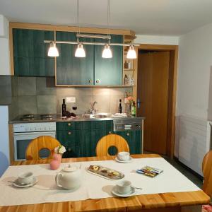 Kuchyň nebo kuchyňský kout v ubytování Apartmenthaus Sun Valley Lodge & Zodiac