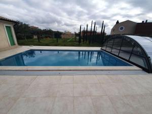 a swimming pool in a yard with a house at Villen Matija & Mima in Fažana