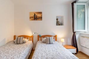 Posteľ alebo postele v izbe v ubytovaní Apartment Spalatin