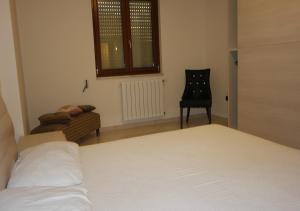 A bed or beds in a room at Appartamento Rosa Virginia