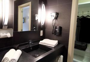 Vannituba majutusasutuses Hôtel L'Amandier