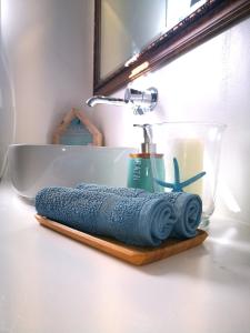 a towel on a cutting board next to a sink at Blu Oceano in Teguise +14 photos