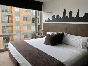 Postel nebo postele na pokoji v ubytování Hotel Apartamentos Regency La Feria