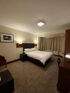 מיטה או מיטות בחדר ב-Clifton House Brighton
