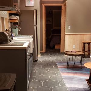 a kitchen with a sink and a counter top at Entire Tiny Home close to cruise ship terminal Alaska Railroad and downtown Seward in Seward