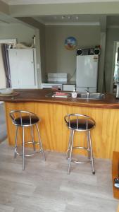 a kitchen with a sink and a counter top at Jacks place in Moeraki
