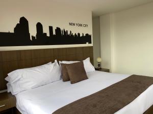 Postel nebo postele na pokoji v ubytování Hotel Apartamentos Regency La Feria
