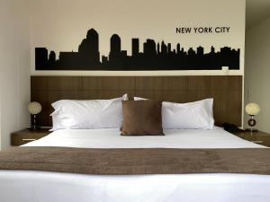 Postel nebo postele na pokoji v ubytování Hotel Apartamentos Regency La Feria