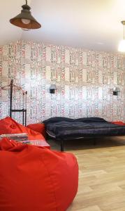 a room with a bed and a wall with writing on it at Authentic Odessa Dacha in Odesa