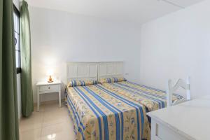 Apartamentos Flamingo客房内的一张或多张床位