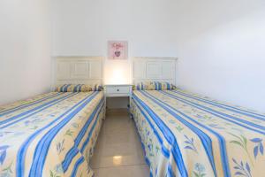 Apartamentos Flamingo客房内的一张或多张床位