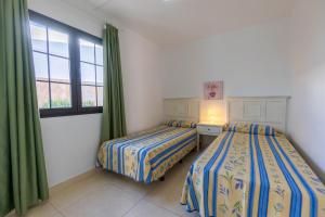 Apartamentos Flamingo客房内的一张或多张床位