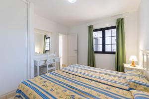Apartamentos Flamingo客房内的一张或多张床位