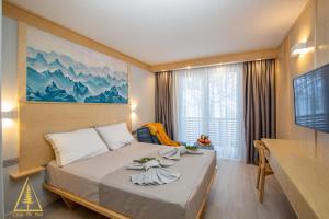 毛茛的住宿－Casa di Pino Eco Lodge，酒店客房,配有带毛巾的床