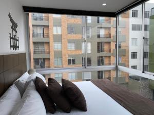 Postel nebo postele na pokoji v ubytování Hotel Apartamentos Regency La Feria