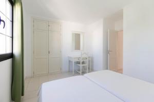 Apartamentos Flamingo客房内的一张或多张床位