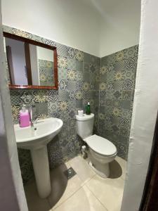 a bathroom with a toilet and a sink at Cairo International Hostel Downtown in Cairo