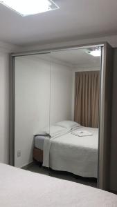 FLAt COMPLETO BEIRA MAR tesisinde bir odada yatak veya yataklar