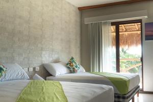 Postel nebo postele na pokoji v ubytování Hotel MAYARI Holbox
