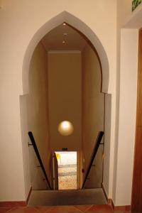 a hallway with an archway in a building at Blue Moon GuestHouse in Lagos