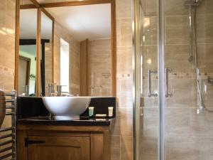 a bathroom with a sink and a shower at Brambles Cottage in Great Malvern +11 photos