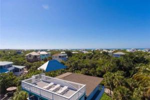 an aerial view of a house with chairs and the ocean at Endless Summer, North Captiva Island in North Captiva