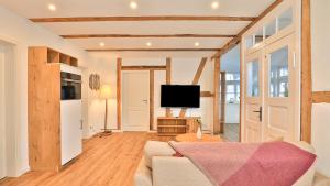 TV a/nebo společenská místnost v ubytování Mühlenhaus Wassermühle