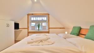 Ένα ή περισσότερα κρεβάτια σε δωμάτιο στο Mühlenhaus Windmühle