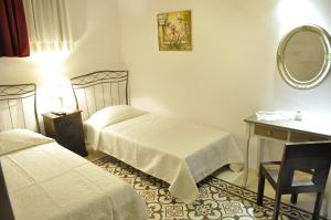 A bed or beds in a room at Villa Amalia