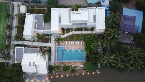 an aerial view of a house with a swimming pool at The B Resort in Kampot