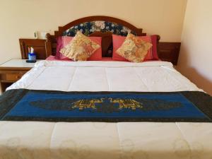 Postel nebo postele na pokoji v ubytování Discovery House Hotel SHA Plus