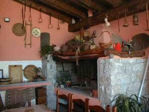 Kuchyň nebo kuchyňský kout v ubytování Agriturismo nuraghe Putzu Canu