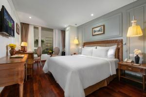 Postel nebo postele na pokoji v ubytování Hanoi Pearl Hotel + 37 fotografií
