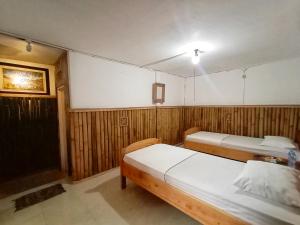 Letto o letti in una camera di Backpacker Kawah Ijen